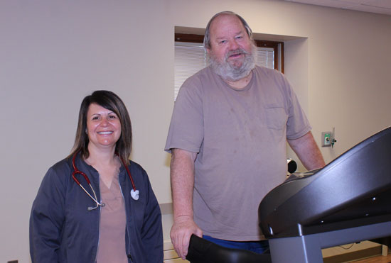 This is a nurse doing a test on a elderly patient for the pulmonary rehab.