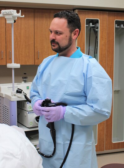 Dr. Josh Thoendel standing in an exam room.
